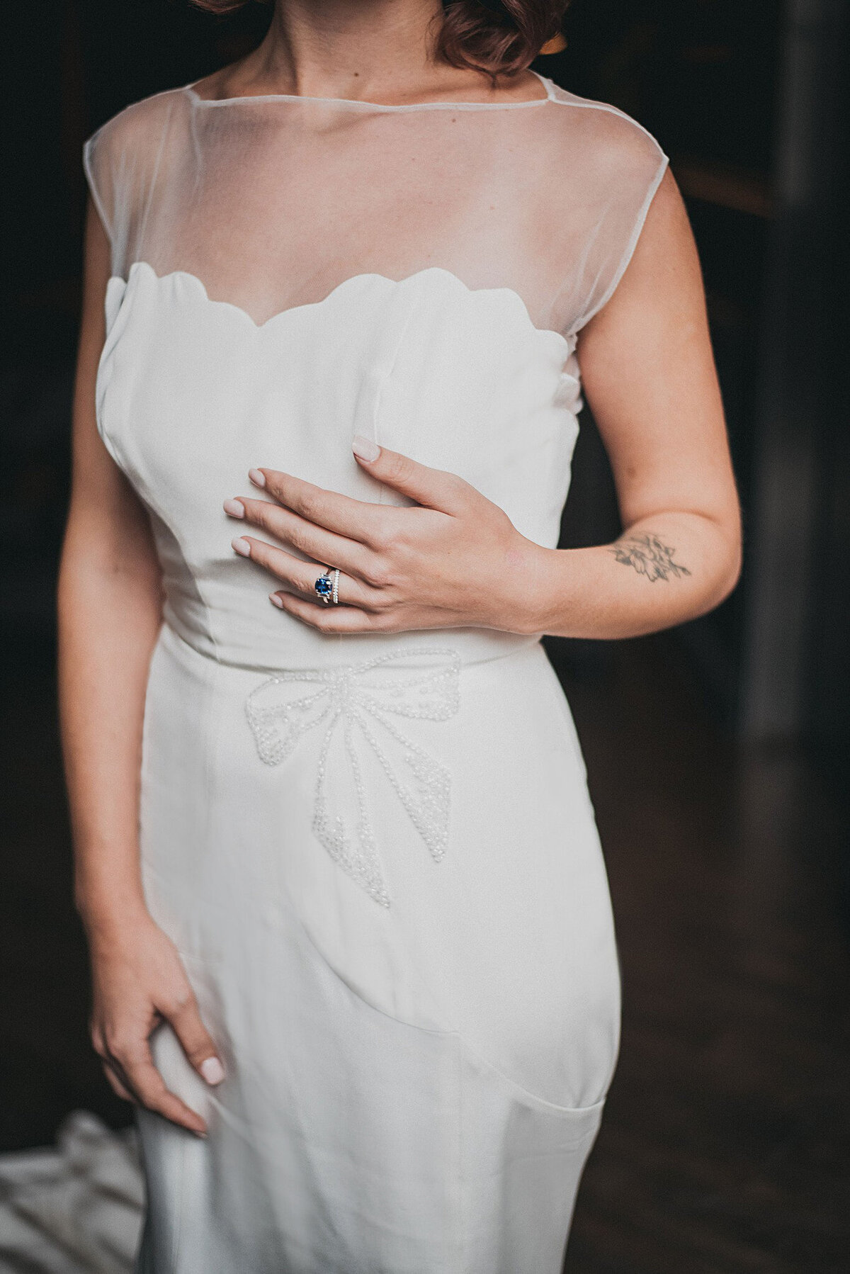 The details on the body of the Zara bridal style are what make this crepe wedding gown stand out. The intricate seamlines on the waist and hips are accented with a 2D beaded bow.
