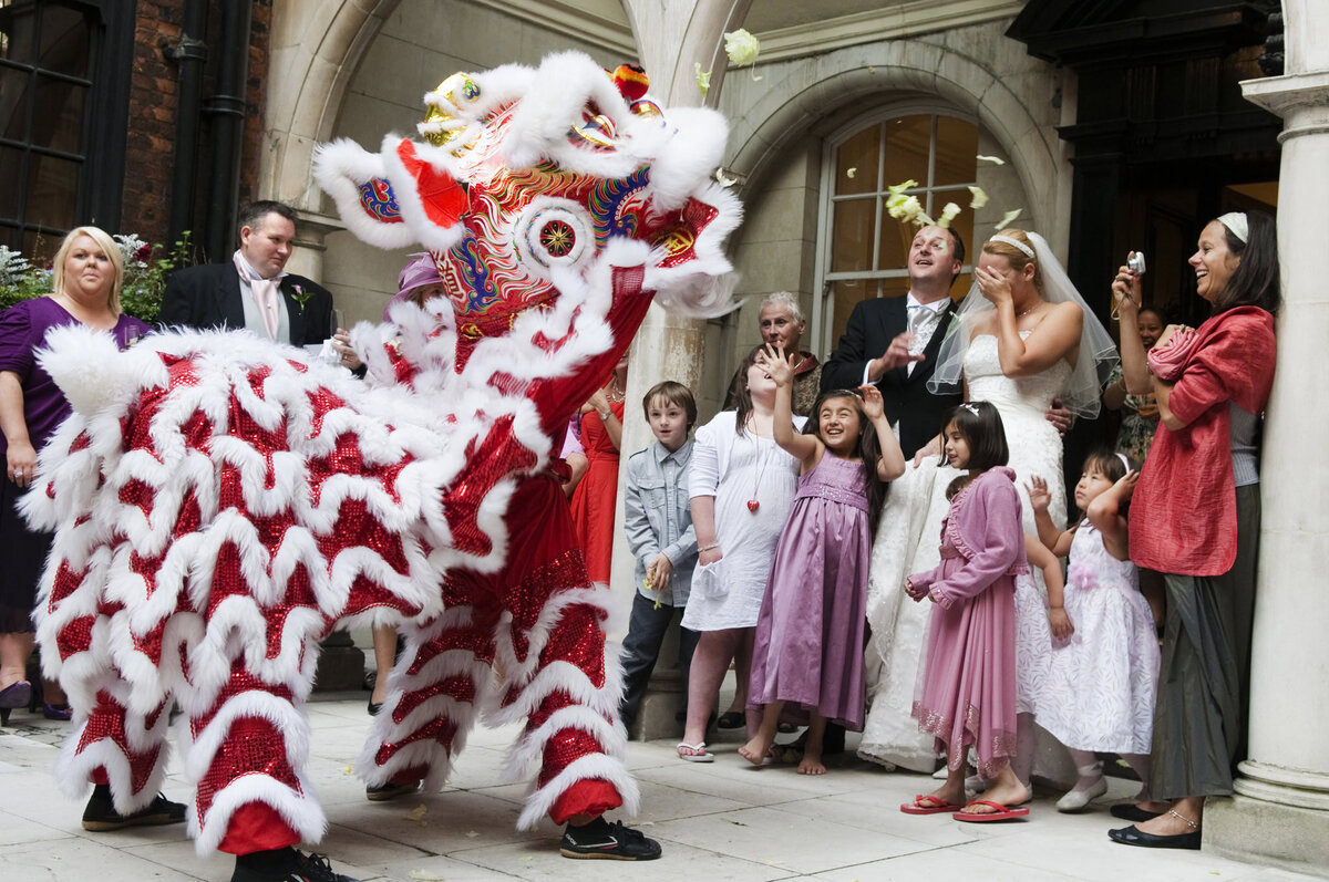 A traditional Chinese lion dance performance at a wedding