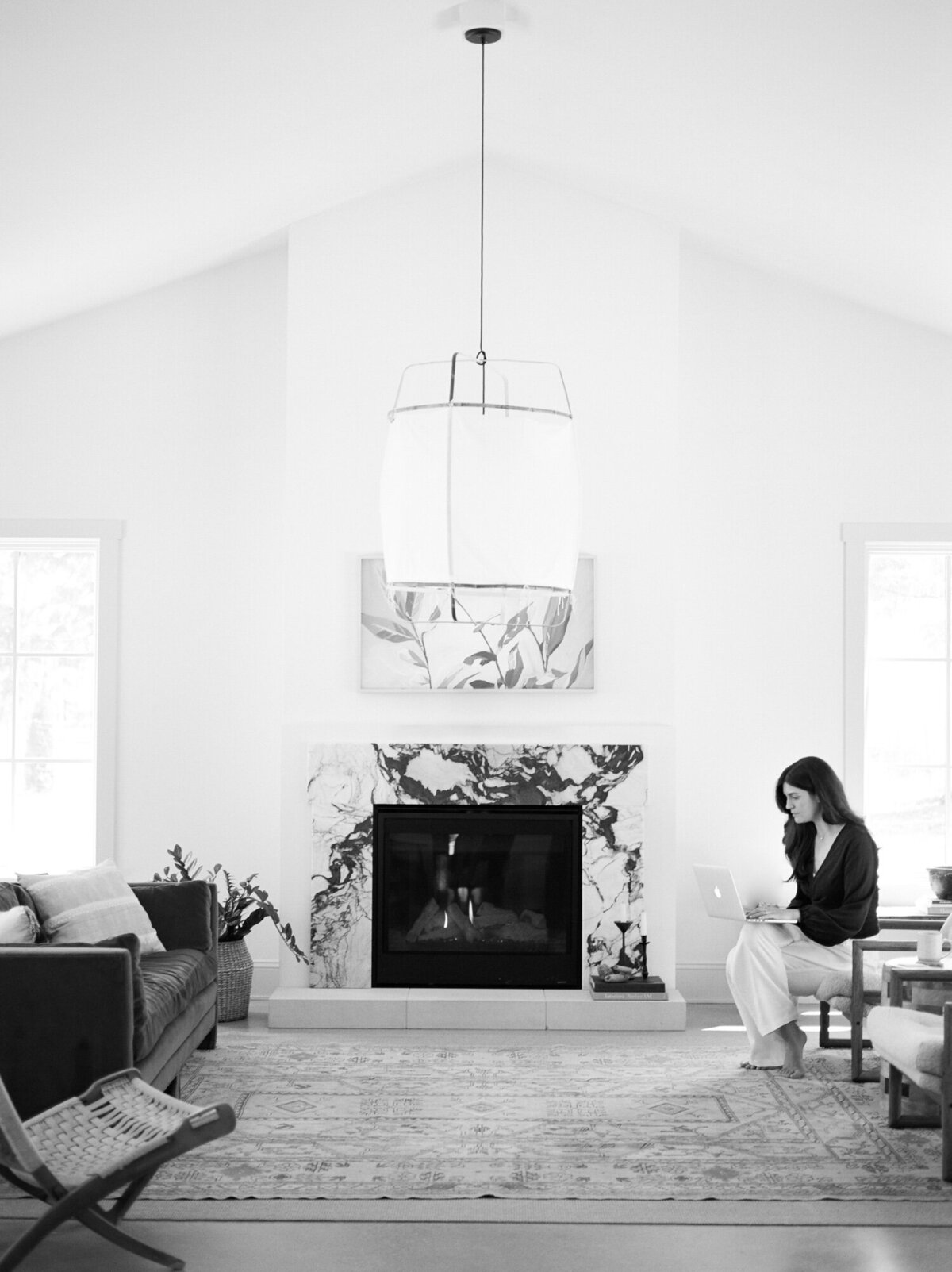 relaxed designer works in living room at Fernhaus, beautiful interior design in Northern Michigan, film brand photos