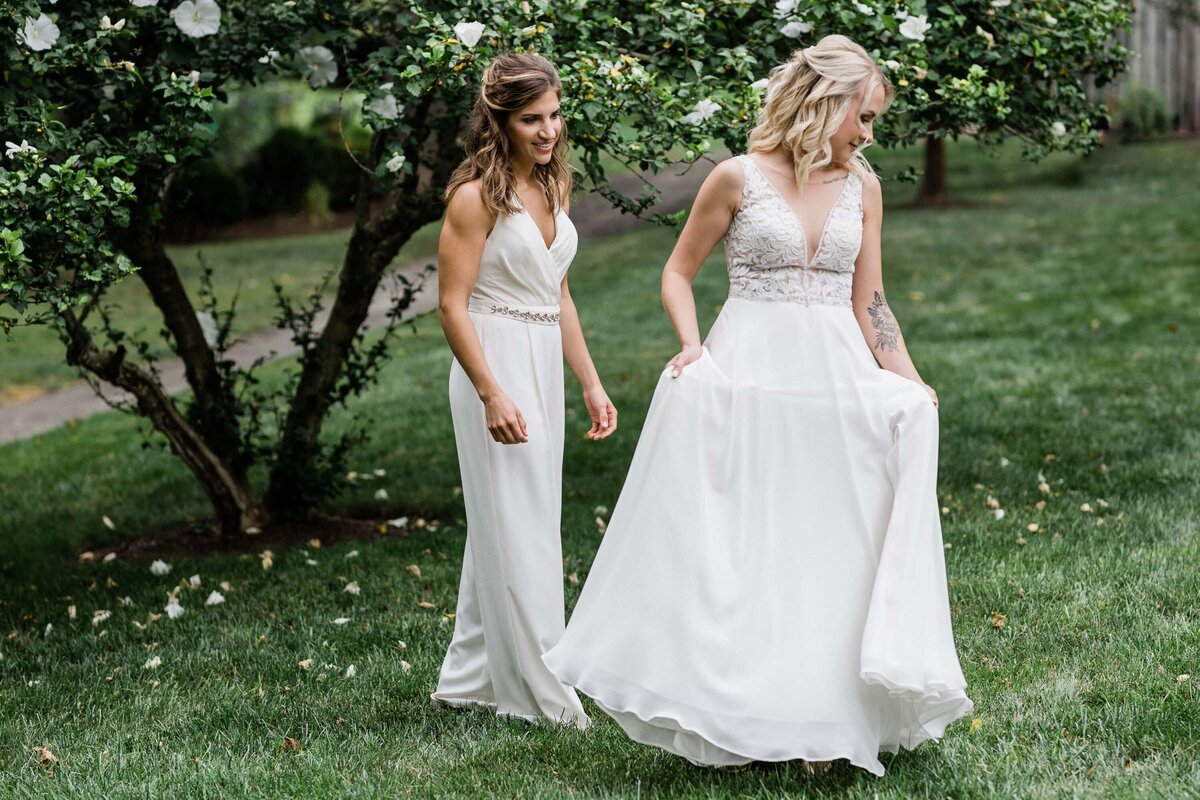 Two brides during their first look at Duportail House