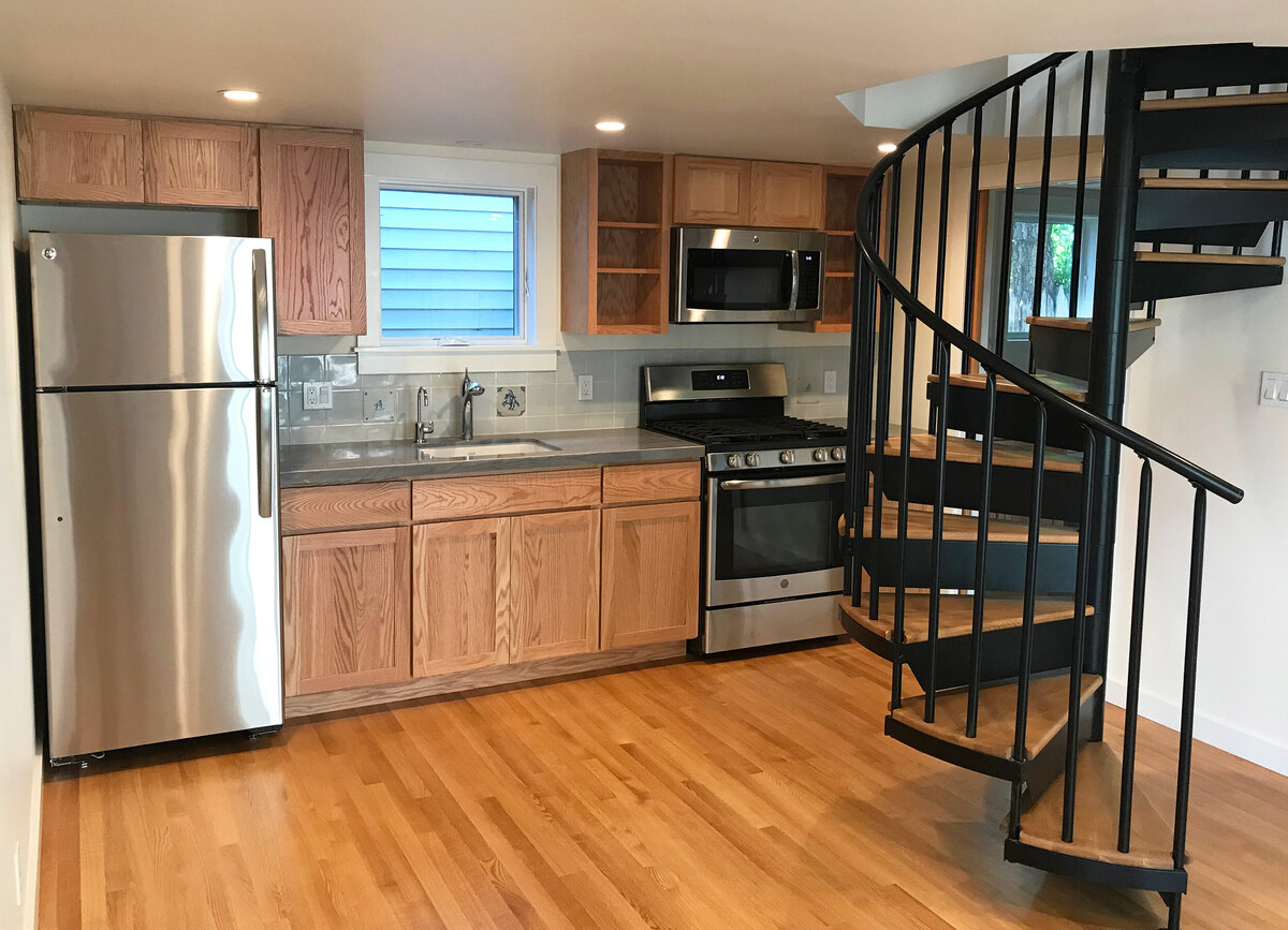 New ADU kitchen with spiral staircase net to it