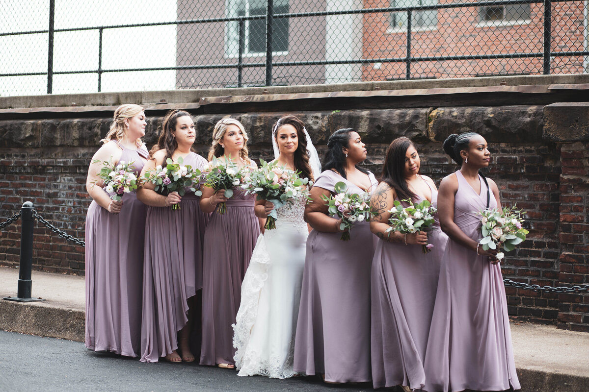 Bridal-party-posing-on-purple-people-bridge-2