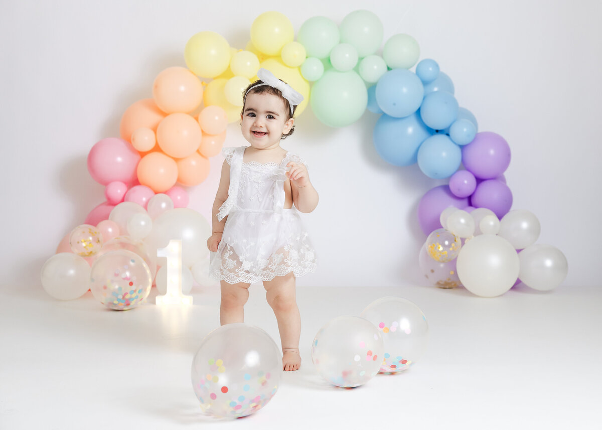 First birthday milestone photo during a cake smash photoshoot in Allison Reilly's Union County, NJ photo studio.