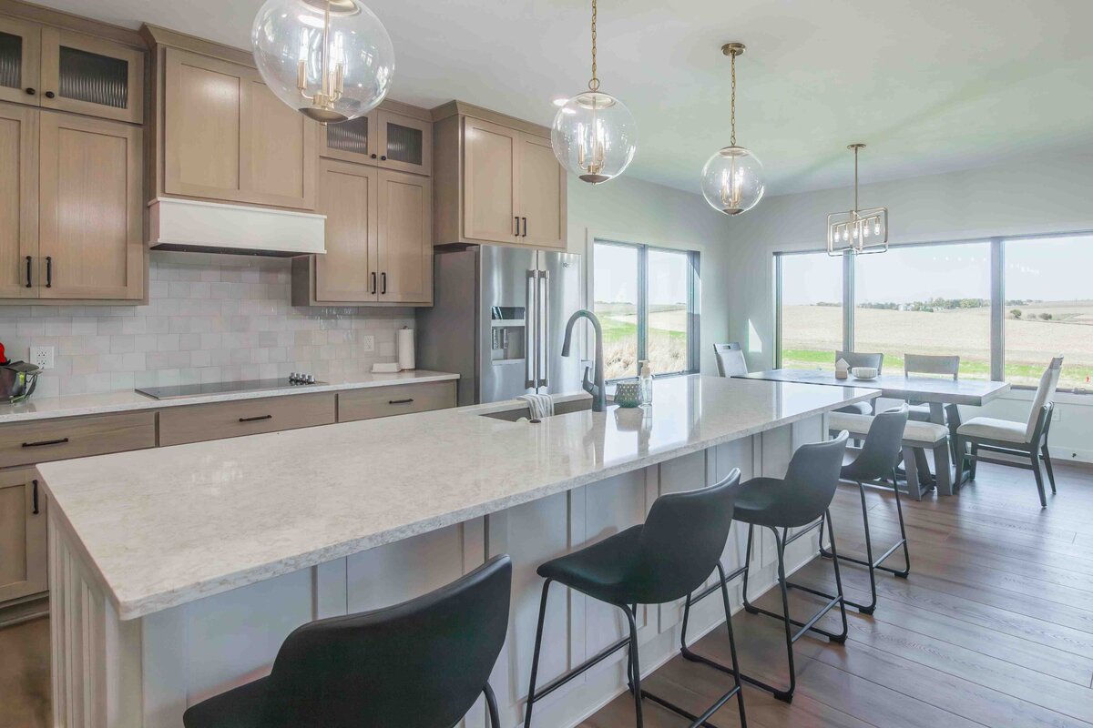golden buffalo kitchen design with long kitchen island and bar stools