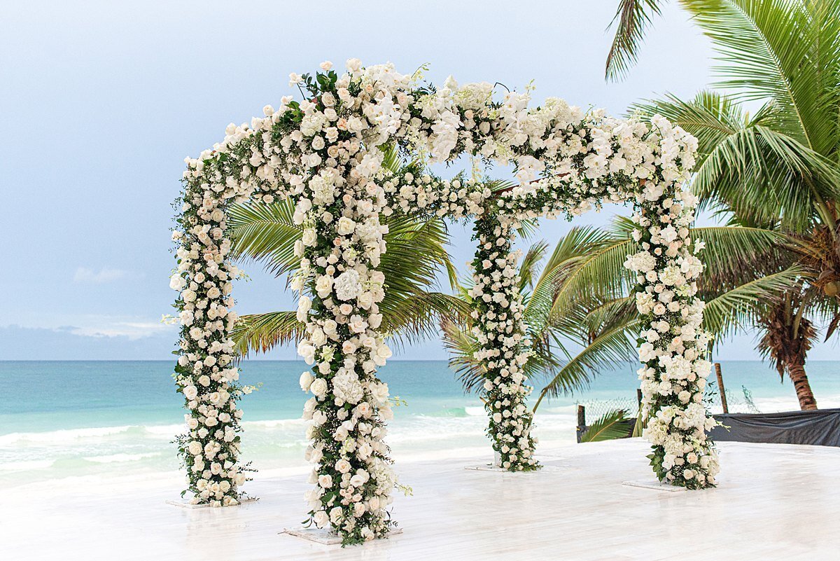 white-floral-ceremony-arch