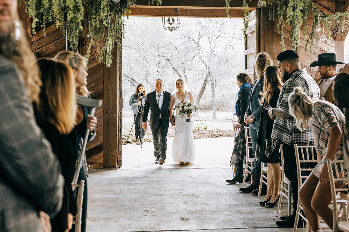 bride entering ranch chapel