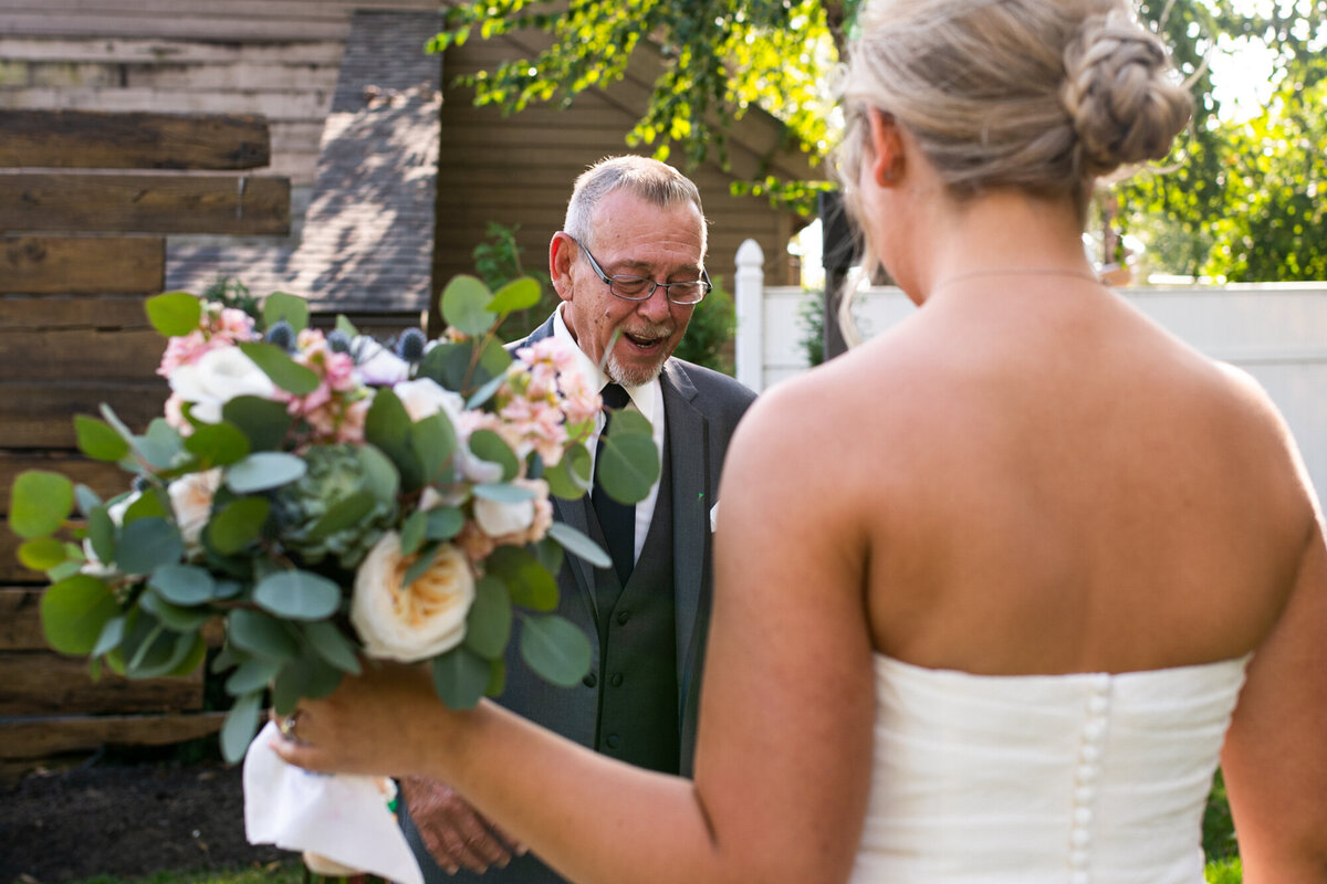 Father of the bride gasps at seeing his daughter for the first time in her wedding dress