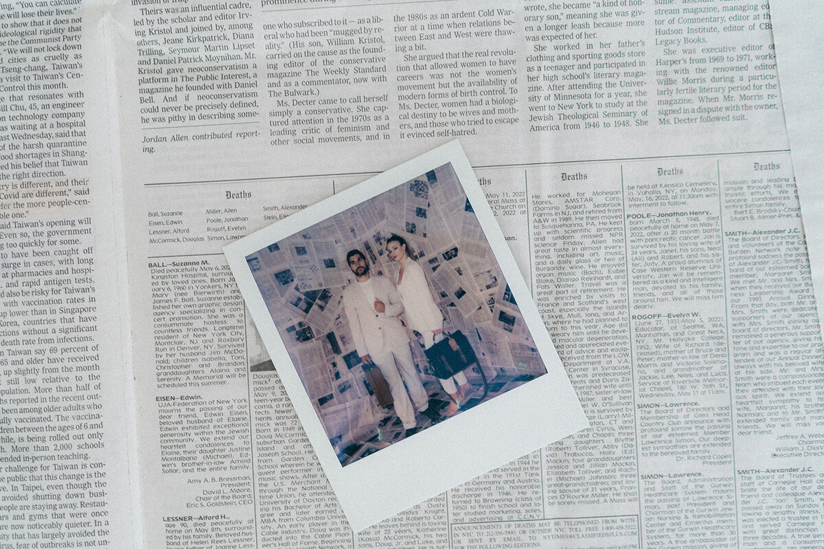 A polaroid on a newspaper
