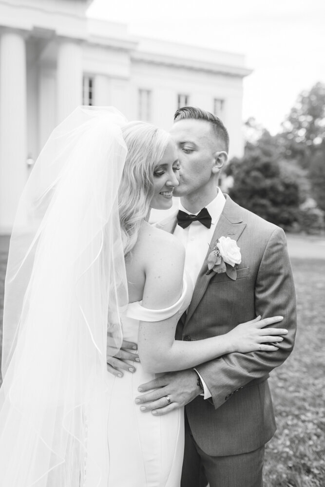groom kissing bride's cheek - Wadsworth Mansion wedding photographer Rachel Girouard