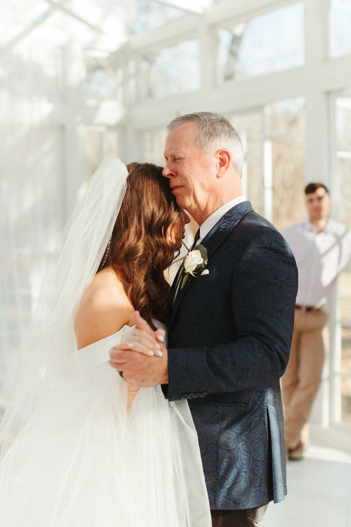 Emotional moment of the father of the bride crying during the father-daughter dance