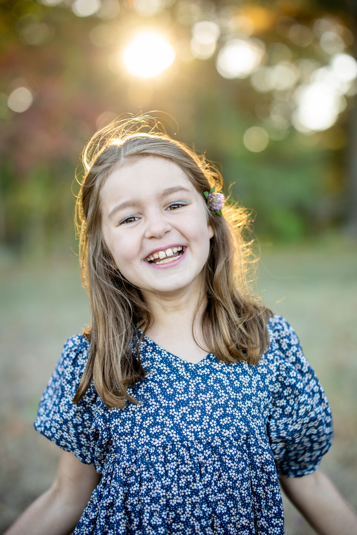 Portrait of girl in flower dress during family photo session