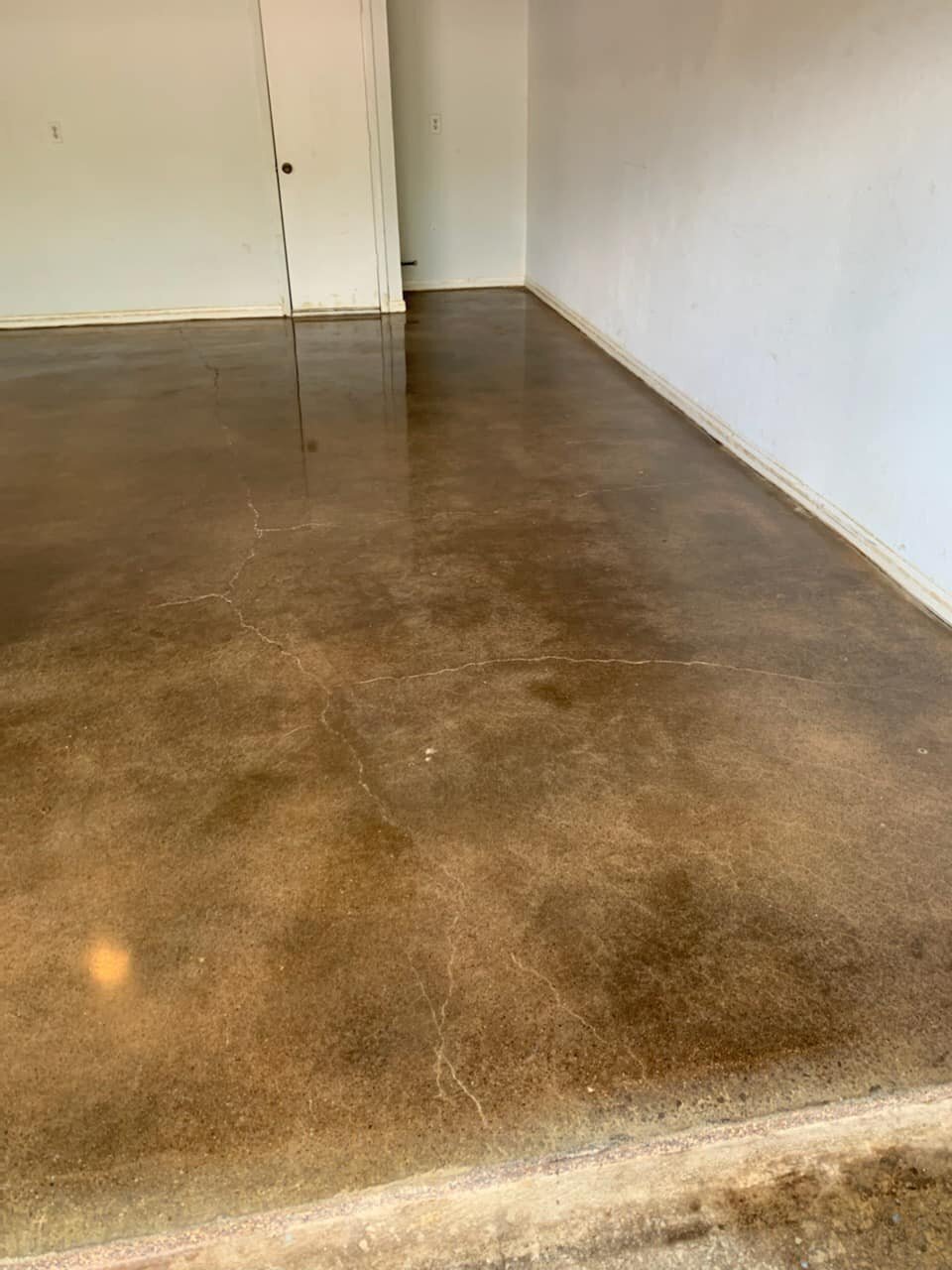 Polished Concrete Floors for Homes in DFW, showcasing a sleek and modern polished concrete floor in a residential living space, highlighting high-quality craftsmanship and durability.