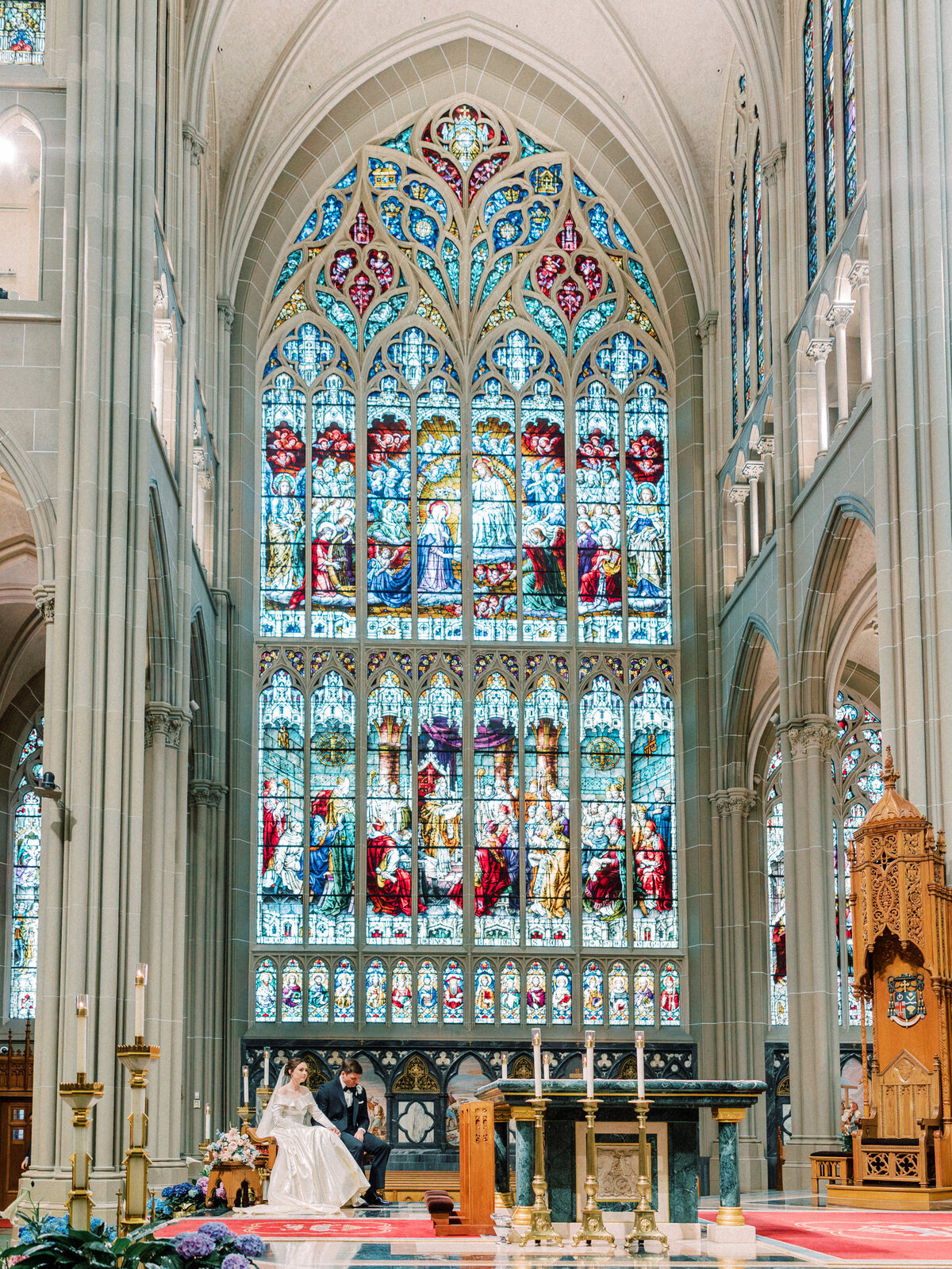 Couple sitting during Cathedral Basilica of the Assumption wedding in Covington, KY