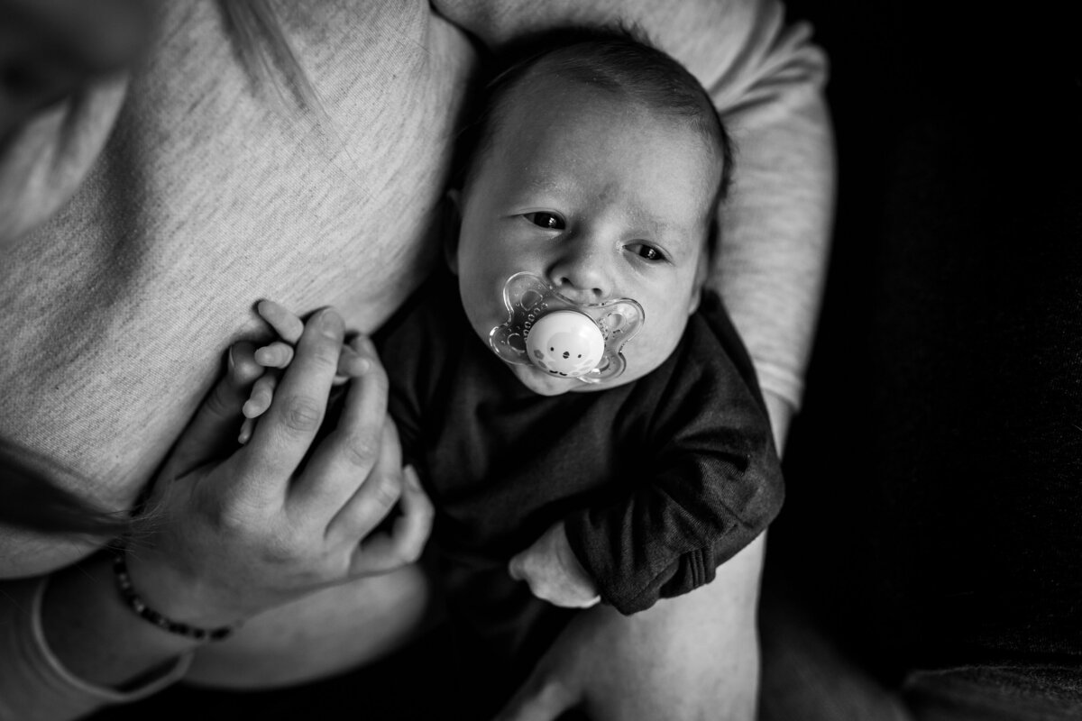 newborn-pacifier-holding-hands