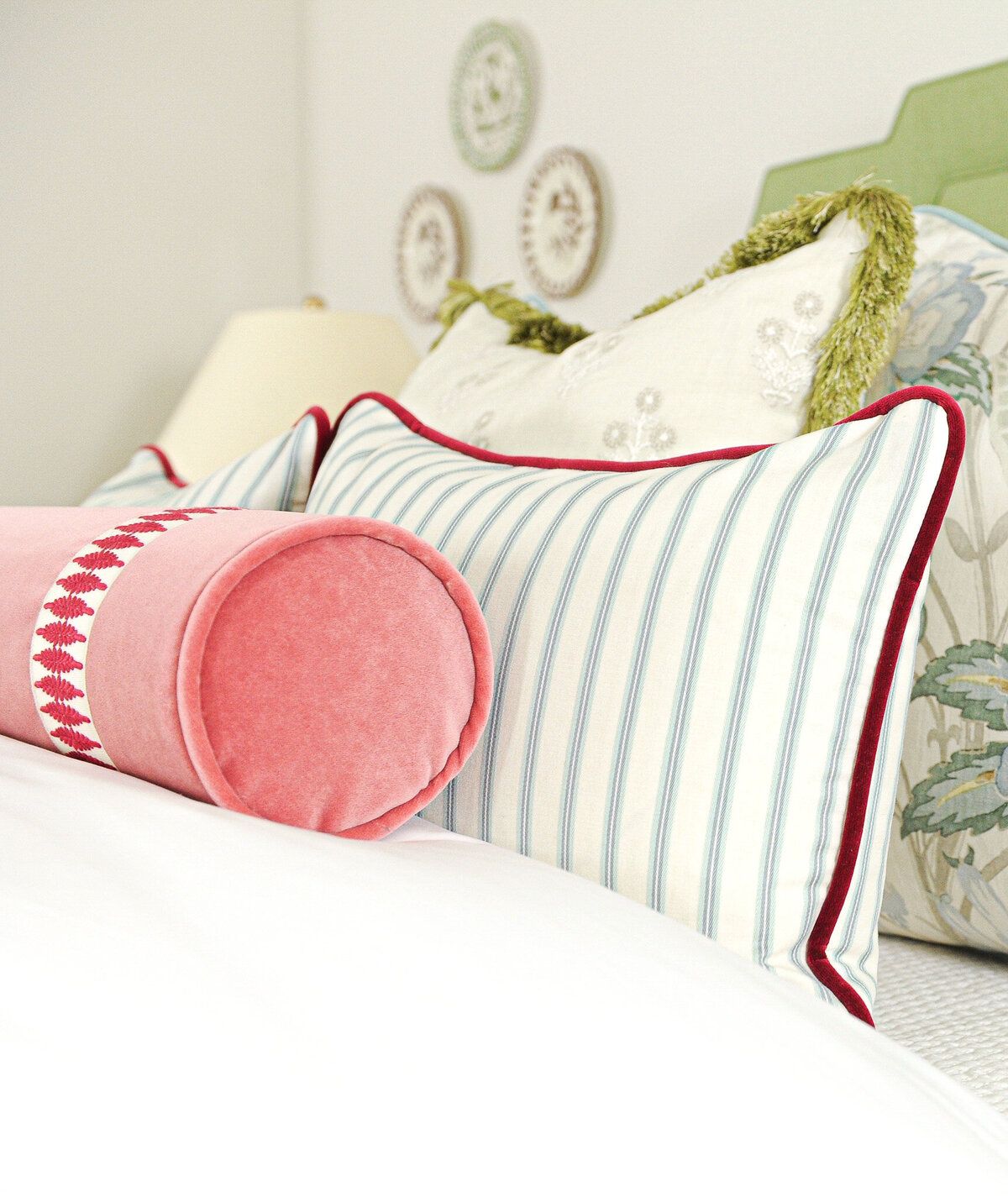 Sophisticated and tailored custom decorative pillows with velvet, striped, and patterned textiles