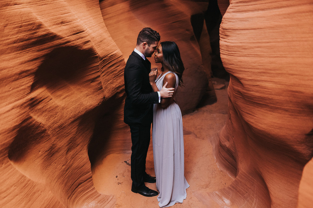 An in love couple during their adventure engagement session in Page Arizona