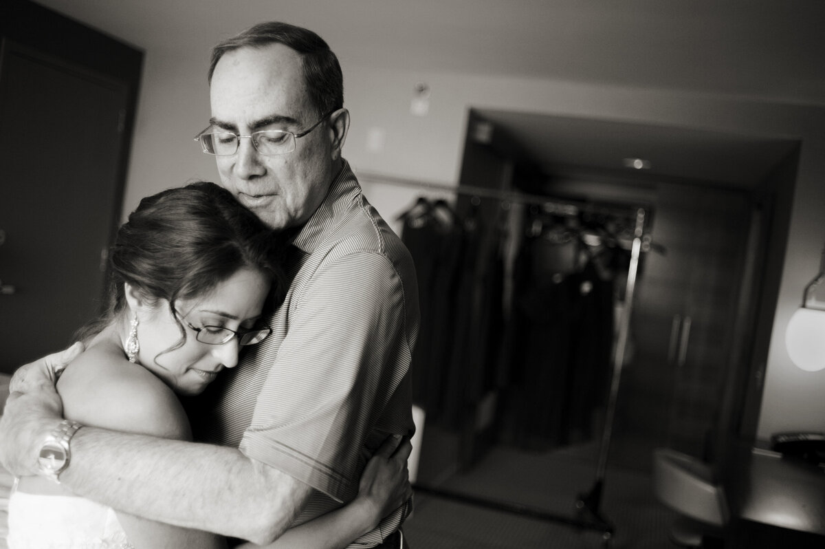A person hugging their child on their wedding day 