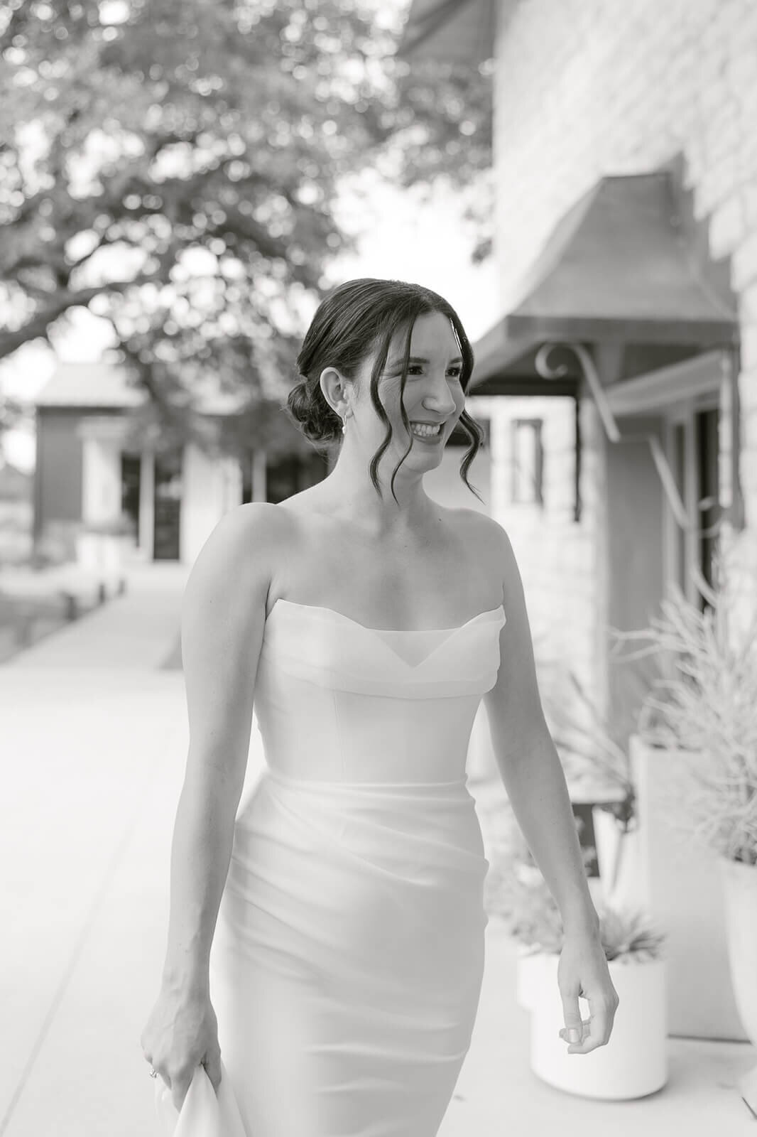 the bride is walking to her first look