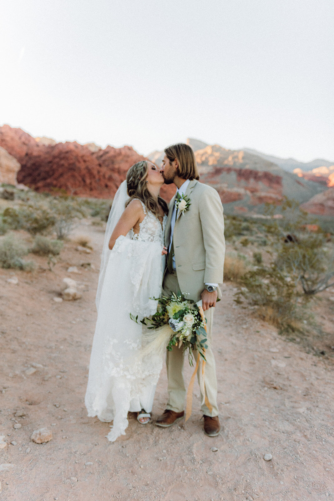Bride and groom kissing during their elopement at the Red Rock Canyon in Nevada
