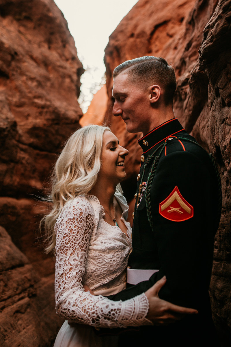 newly weds laughing in a New Mexico anyon