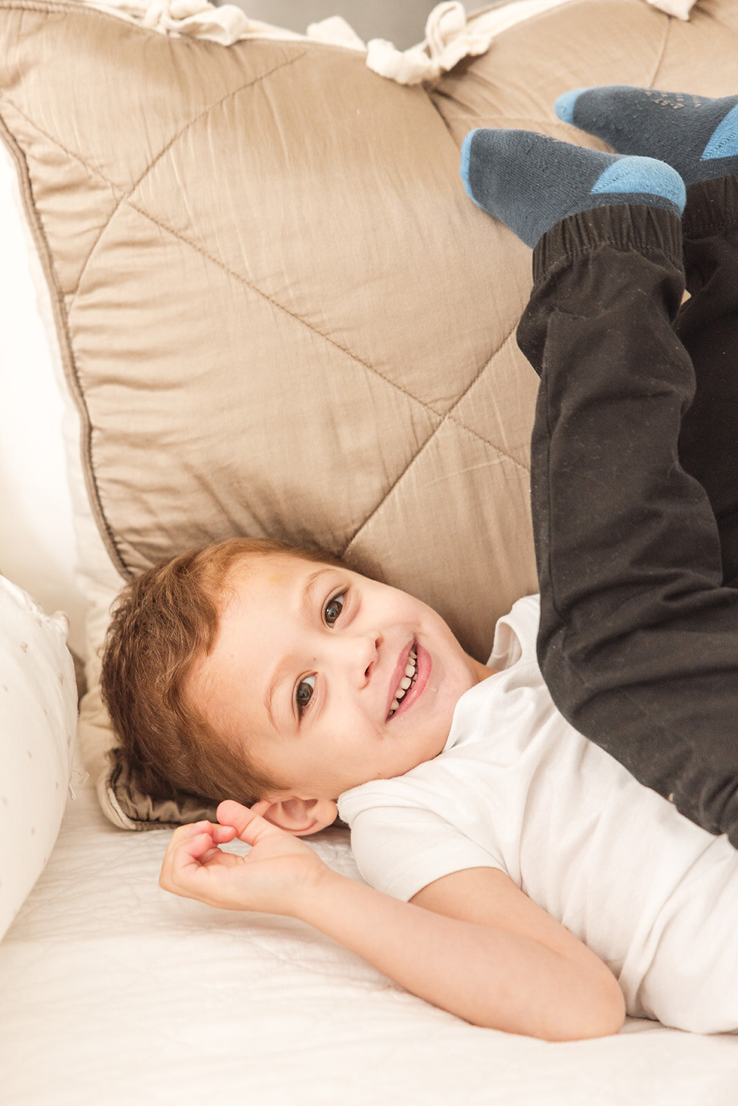 Father snuggling baby girl during relaxed in-home photo shoot in Orlando

