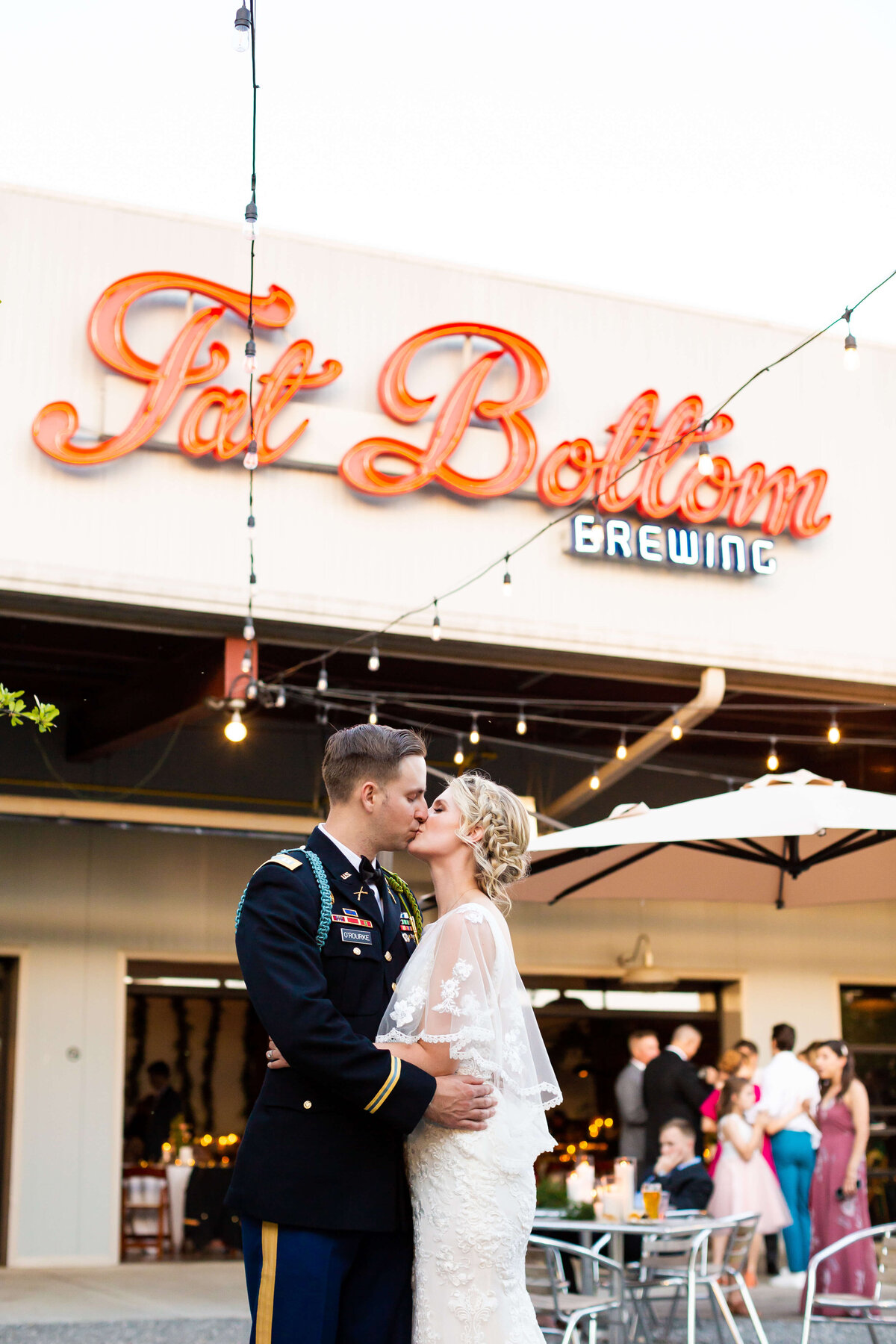 Bride and groom kissing at Fat Bottom Brewery wedding in Nashville, TN