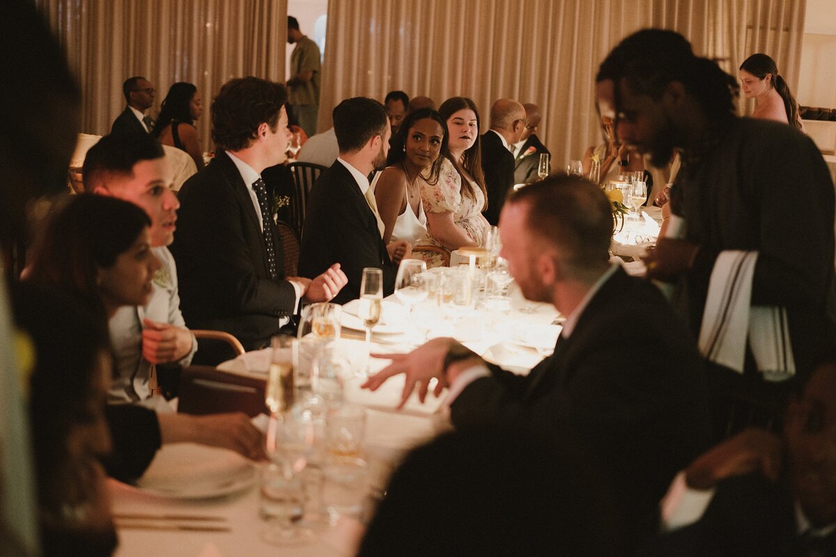 romantic reception table at parlour filled with guests