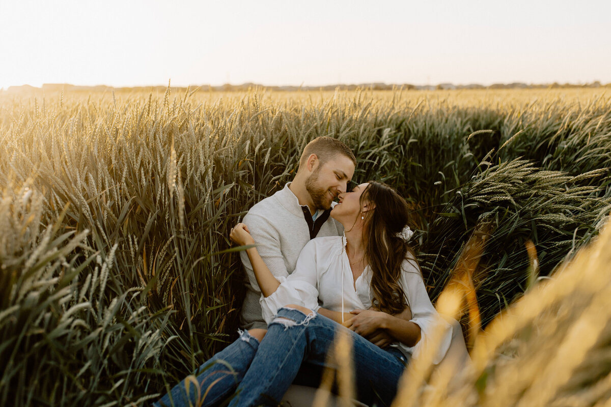 couple sitting in tall grass