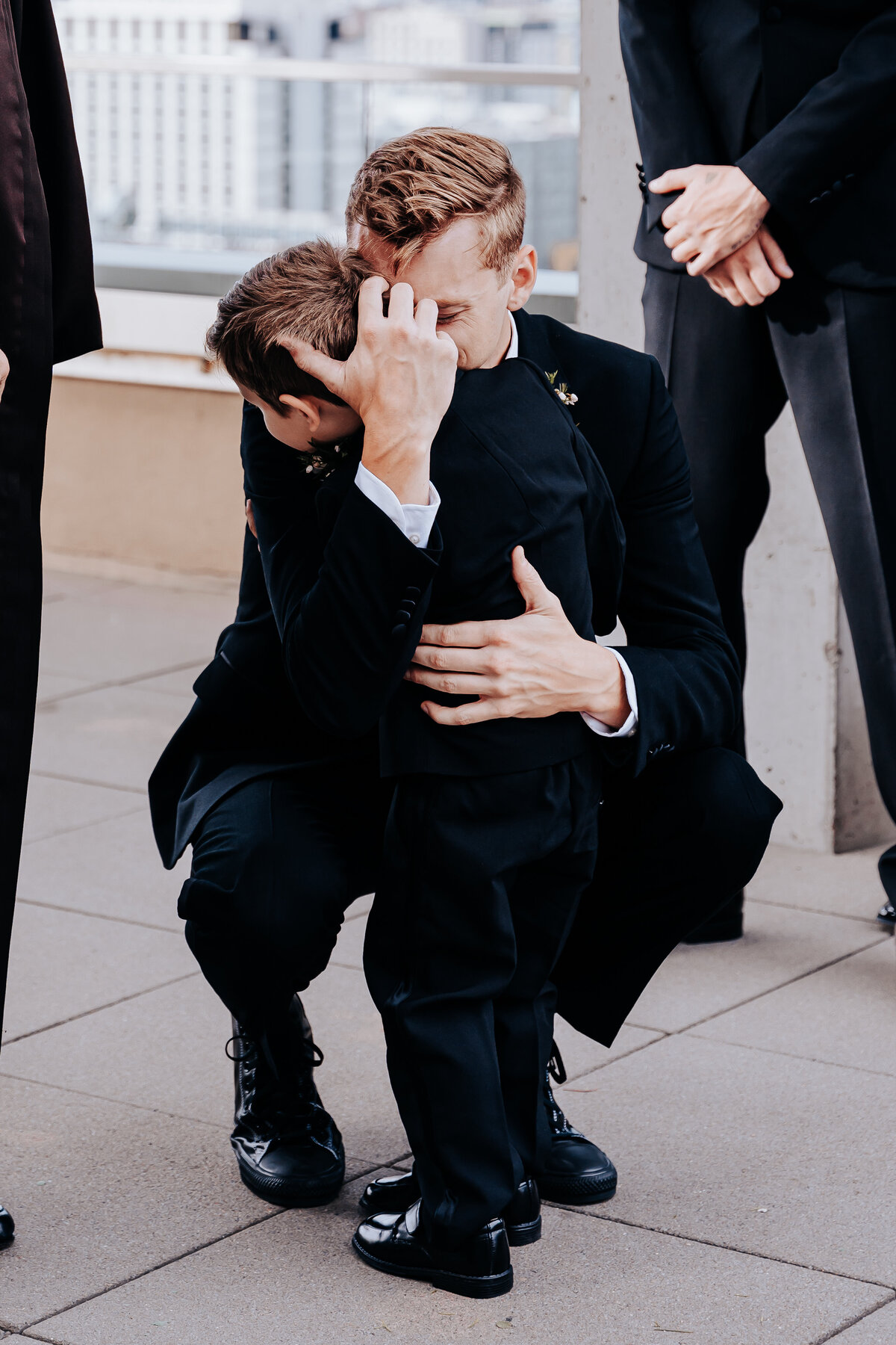 Nashville wedding photographer captures groom hugging son