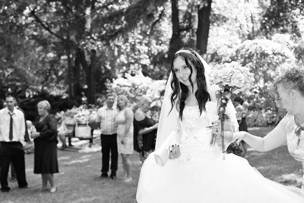 Bride Walking with Support on Wedding Day