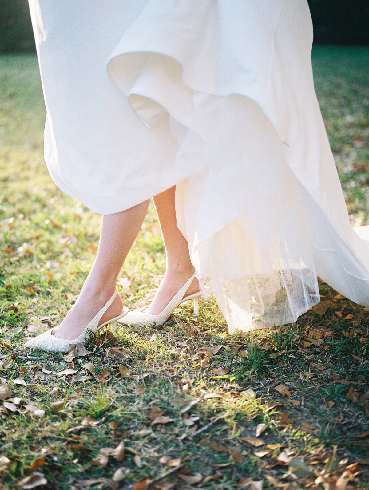 bride heels in white dress on film photography