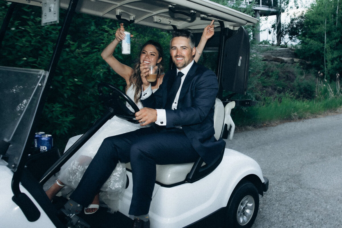 Couple in a golf cart on their wedding day captured by Victoria Pattemore, adventurous and authentic wedding photographer in Calgary, Alberta. Featured on the Bronte Bride Vendor Guide.