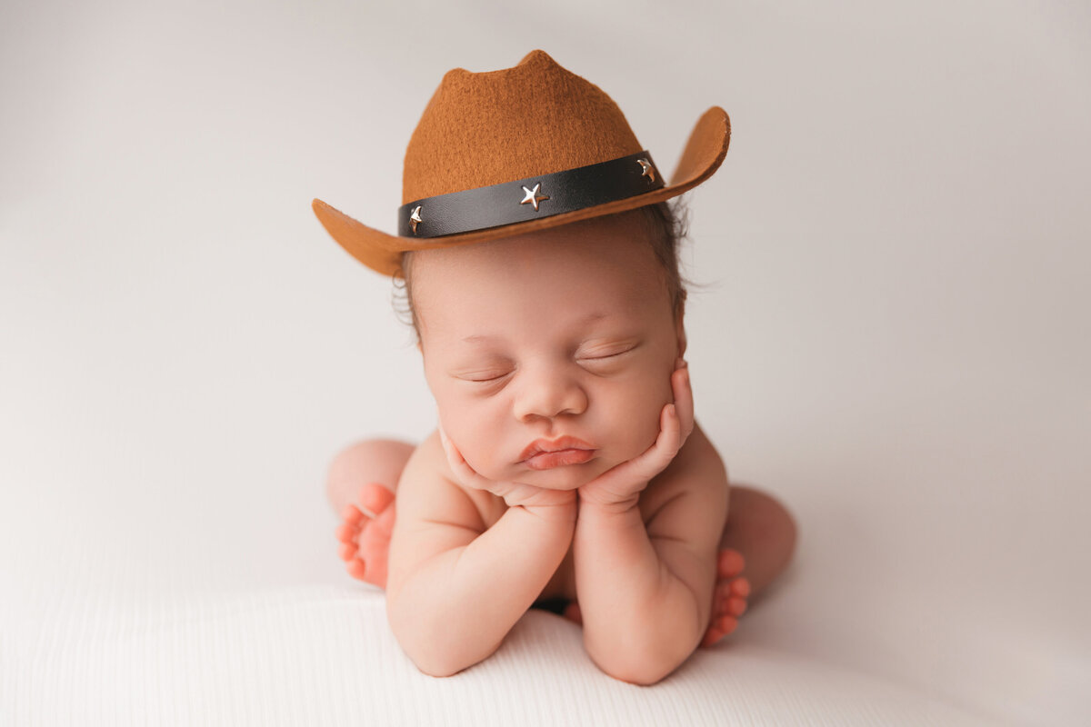 baby boy in cowboy hat phoenix newborn session