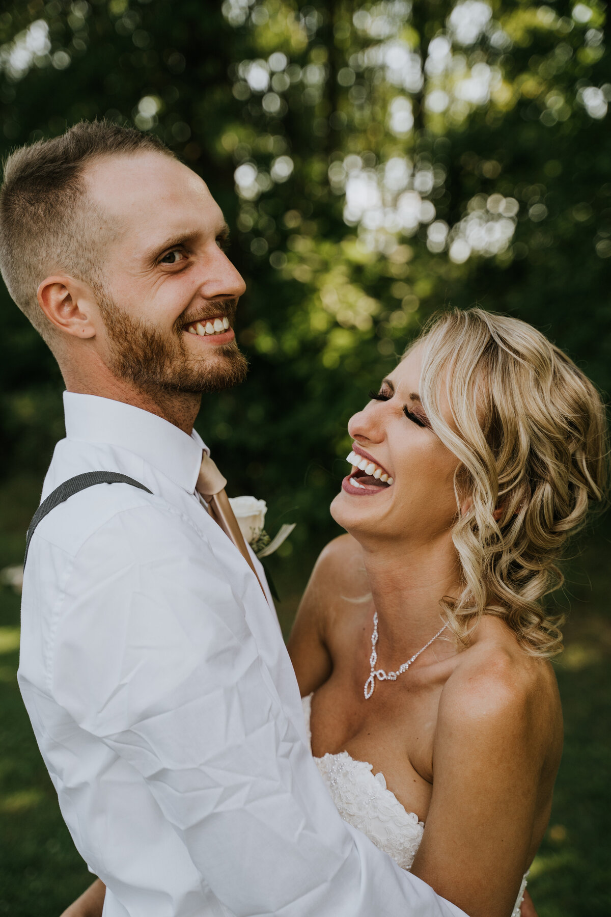 Couple laughs after wedding reception