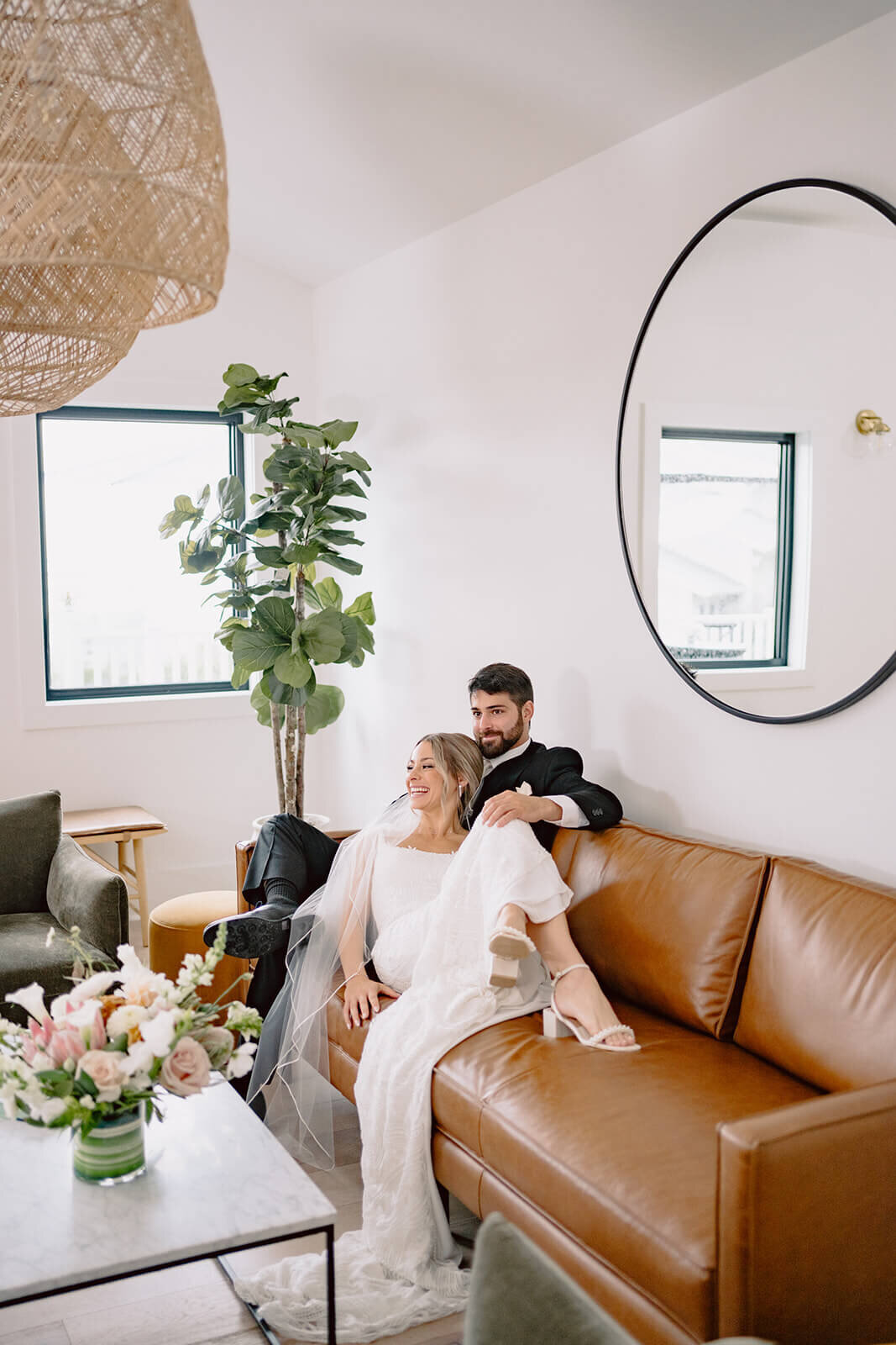 Bride and groom relaxing on sofa
