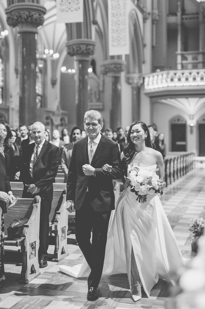 Bride walking down the aisle with father