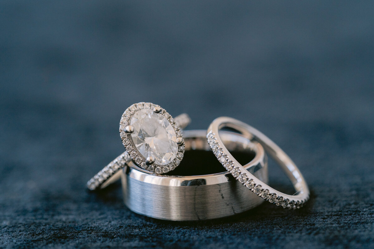 close up shot of the wedding rings and engagement ring