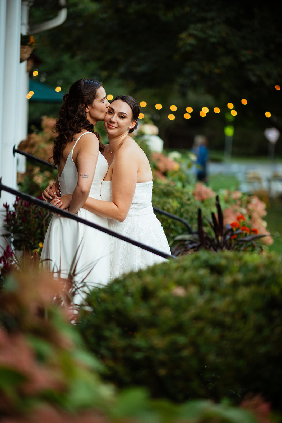 Bride kissing her bride's forehead