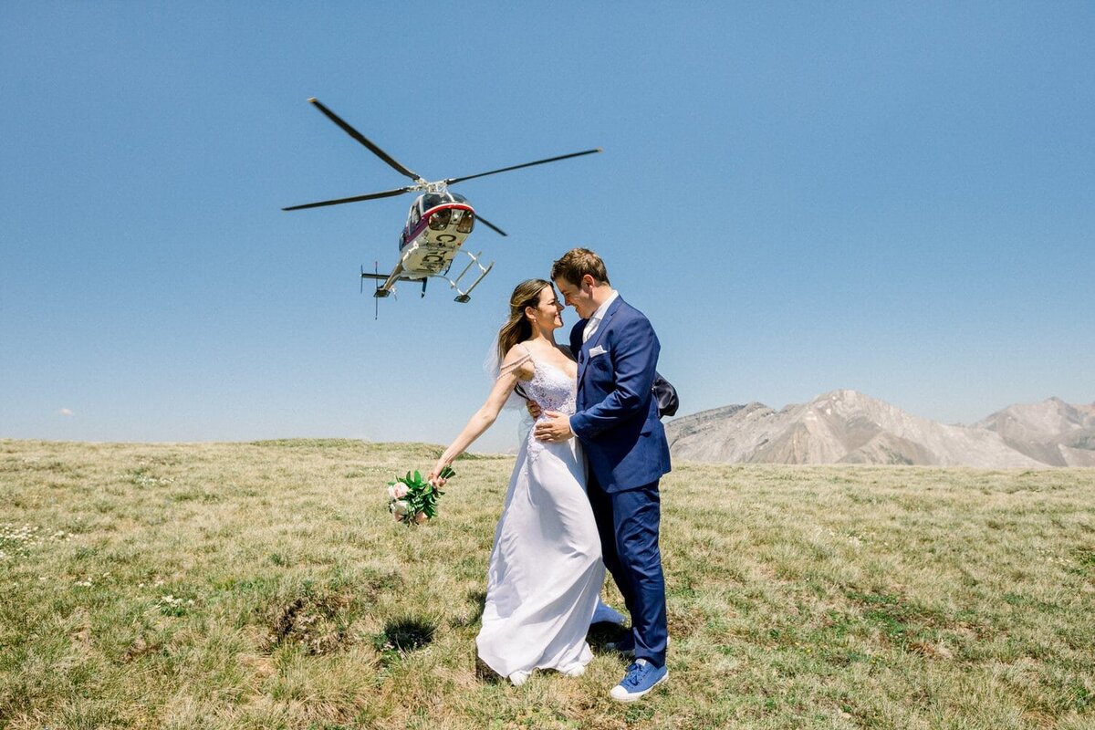 Alpine-Helicopter-flying-over-the-bride-and-groom-during-their-private-helicopter-elopement