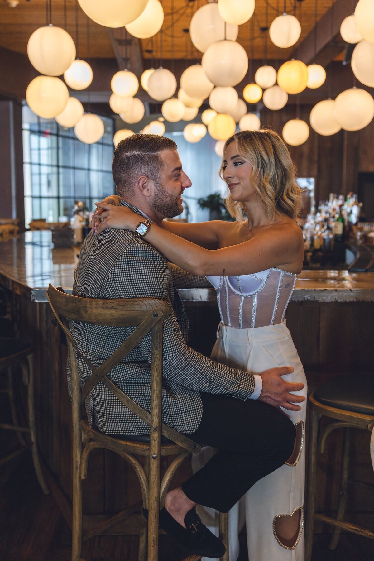 Fun candid moment of couple dancing at Felina’s bar.