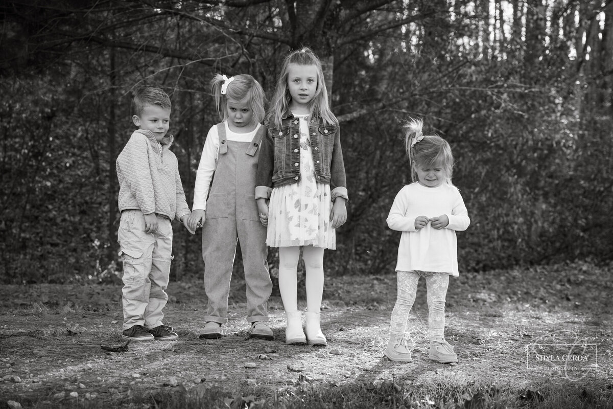 Cousins together during outdoor fall family session