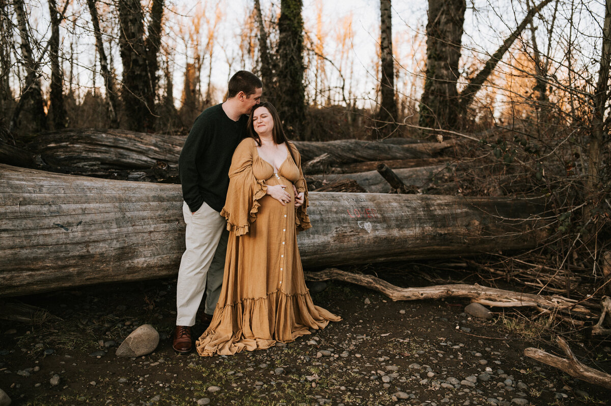 couple kissing at park during session with Beaverton photographer