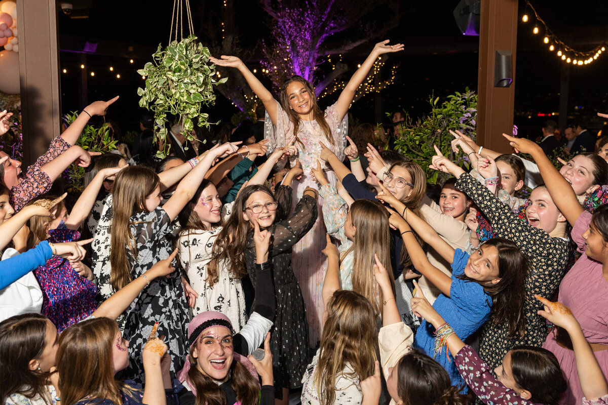 A group of kids dancing at a party