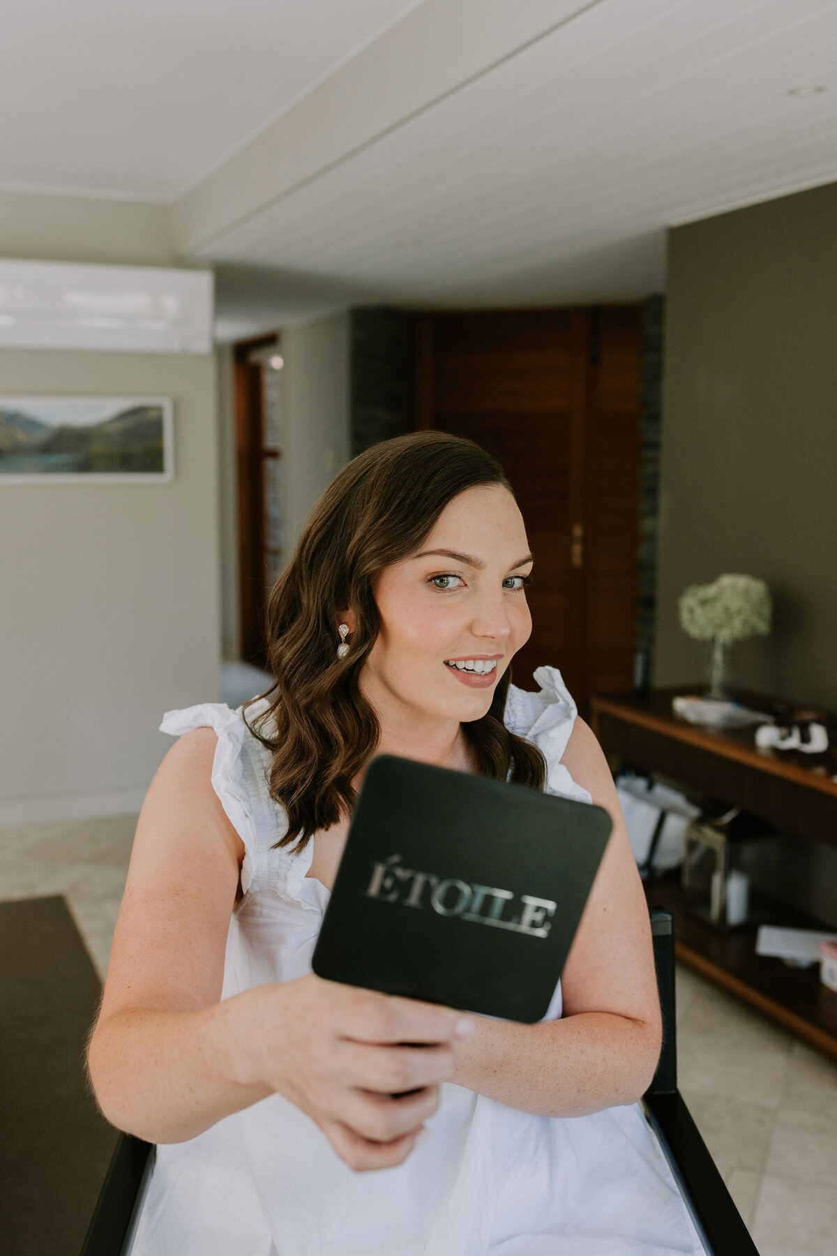 bridal makeup reveal in mirror for queenstown wedding