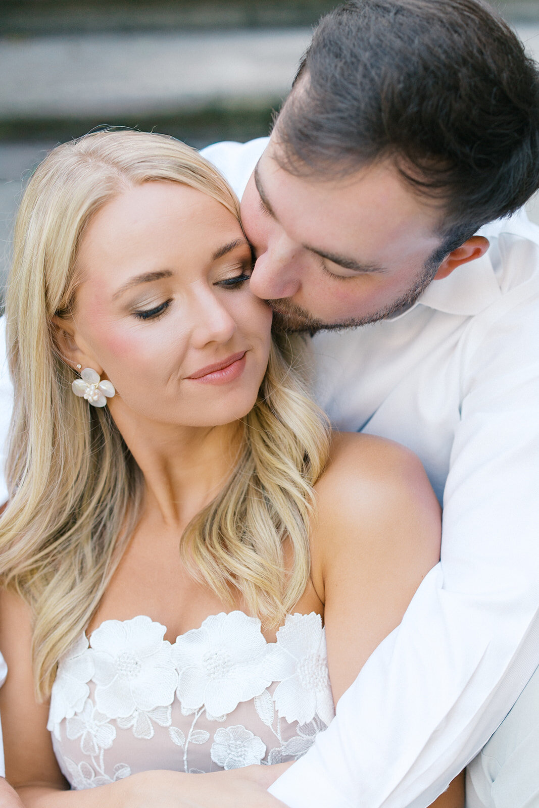 Guy kisses fiance on cheek at Swan House in Atlanta Georgia