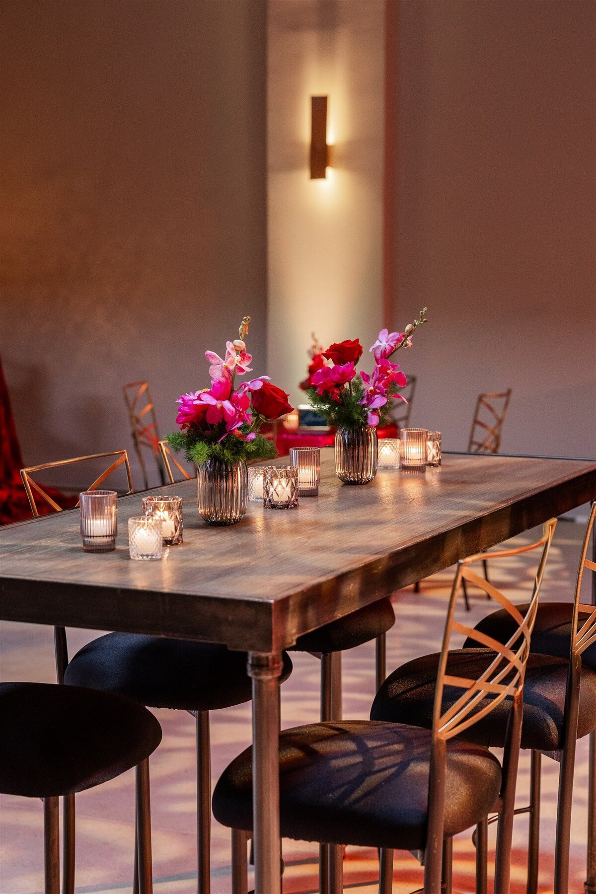 Event space styled with a Baroque theme, featuring ornate gold accents, rich fabrics, grand chandeliers, and intricate moldings, creating a luxurious and dramatic atmosphere
