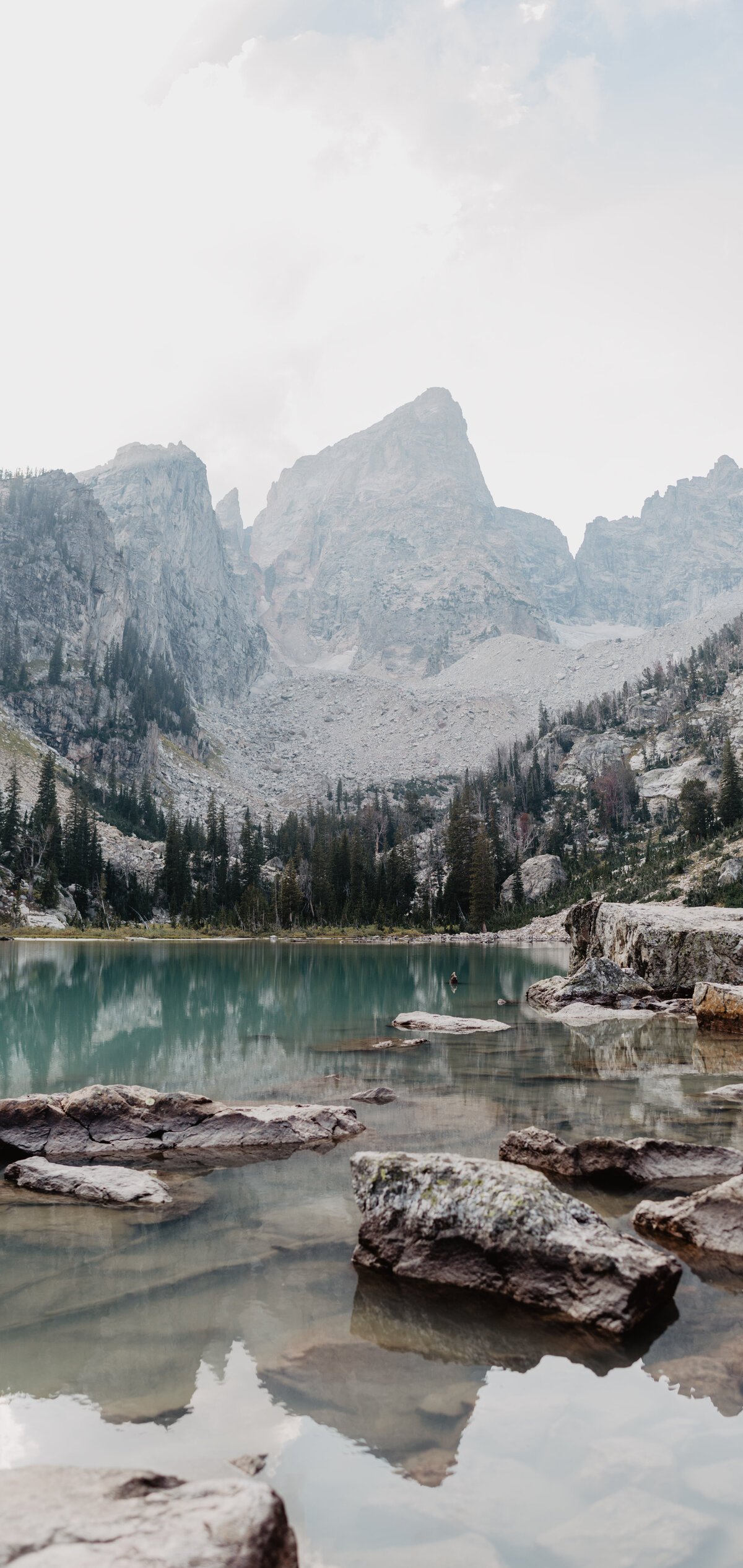 Jackson Hole Photographers capture Grand Tetons landscape with lake and snow