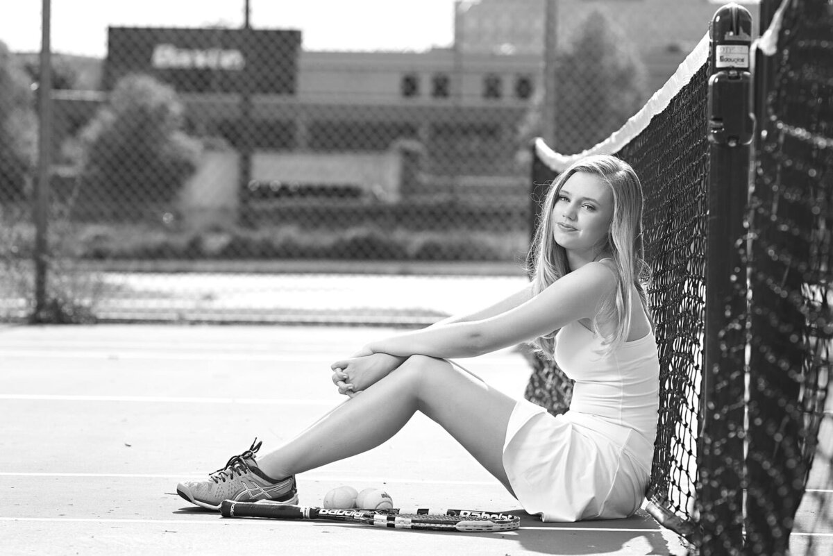 Senior Picture Photographer Captures High School Tennis Portrait in Black and White-02