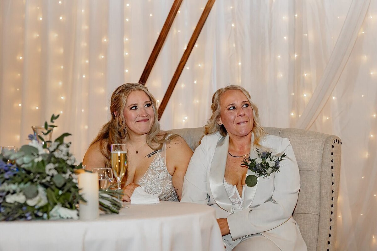 Colorado wedding photo of bride and bride smiling at reception