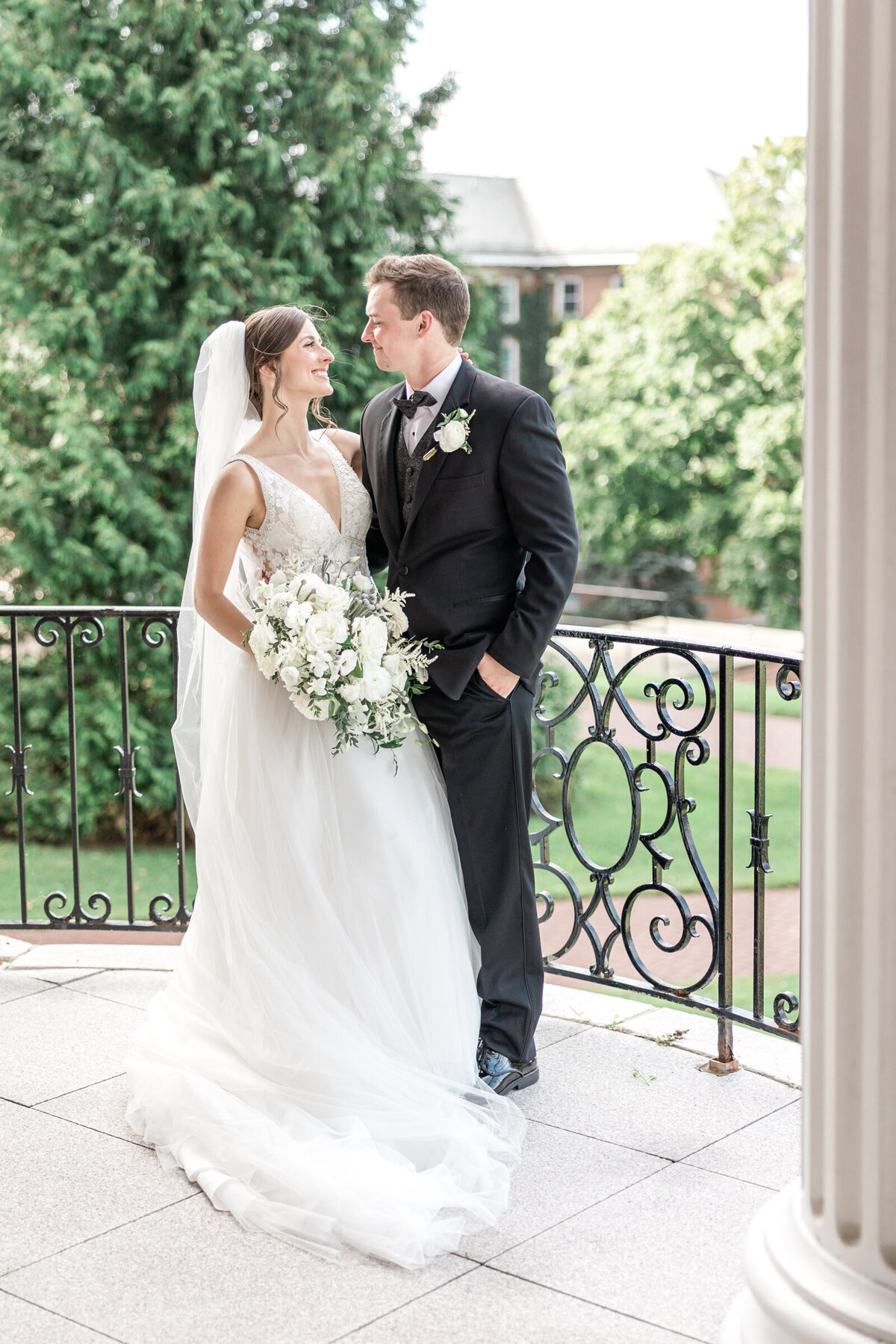 Married couple gaze lovingly at each other after sharing their vows